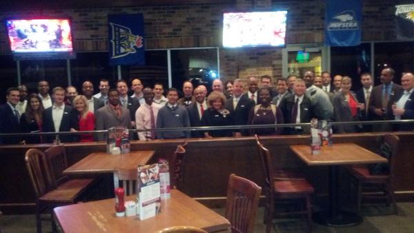 large group of attendees standing together posing for photo