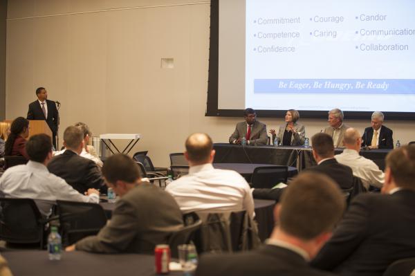 Attendees listening to panel discussion
