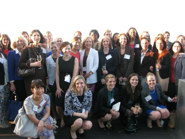 The group of women attendees pose for a photo
