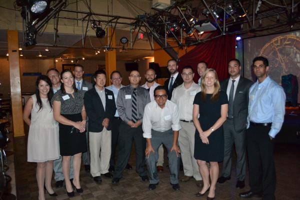 attendees pose for group photo