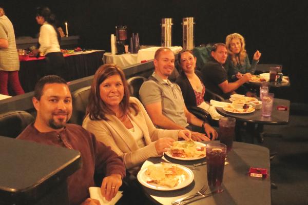 Some of the attendees sitting at tables eating