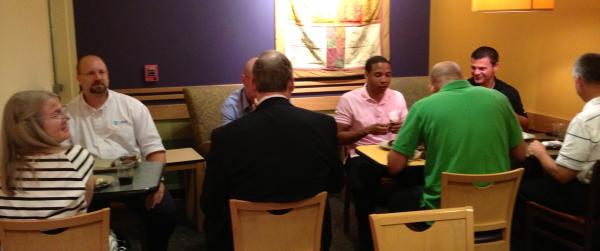 Protégés and Mentors sitting at tables at Panera Bread